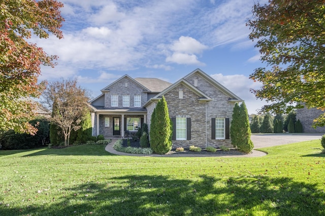 craftsman inspired home with a front yard