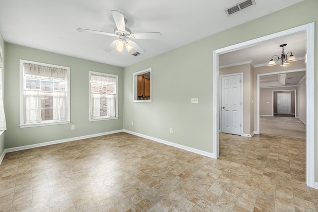 empty room featuring ceiling fan with notable chandelier and ornamental molding