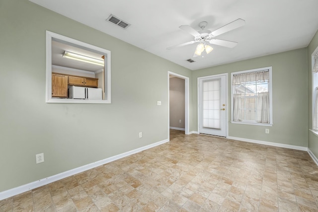 empty room featuring ceiling fan