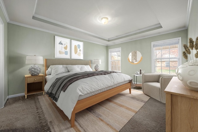 carpeted bedroom featuring a raised ceiling and crown molding