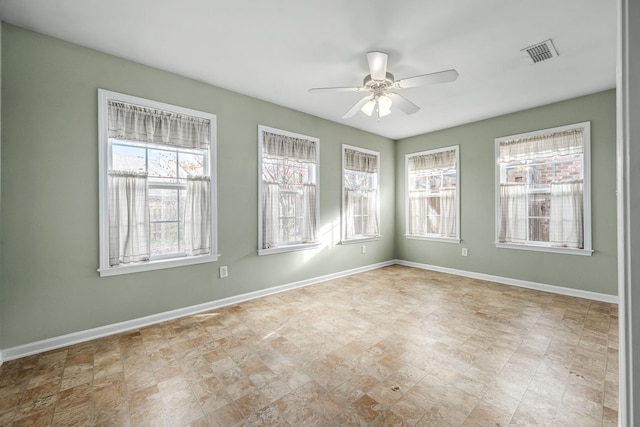 unfurnished room with ceiling fan