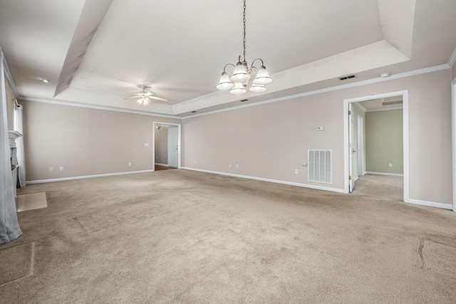 unfurnished room featuring light colored carpet, a raised ceiling, and ornamental molding