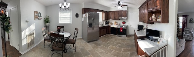 kitchen with hanging light fixtures, light hardwood / wood-style flooring, dark brown cabinets, ceiling fan with notable chandelier, and appliances with stainless steel finishes