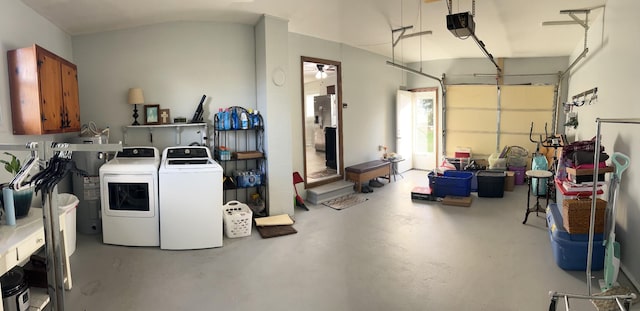 garage with washer and dryer and a garage door opener