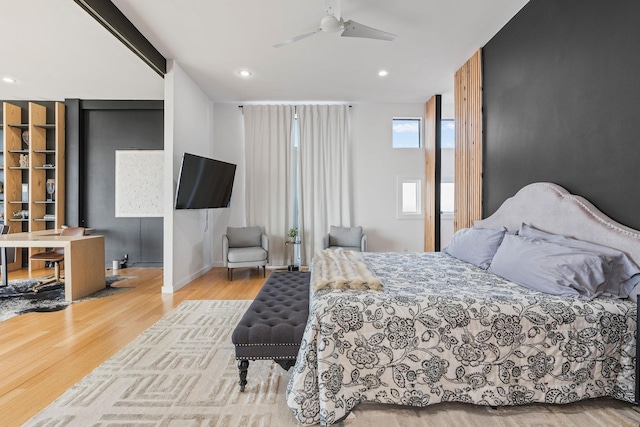 bedroom featuring ceiling fan and light hardwood / wood-style flooring