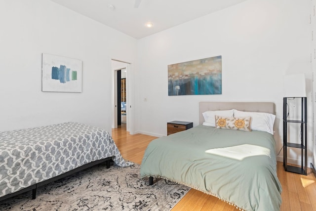 bedroom with wood-type flooring and ceiling fan