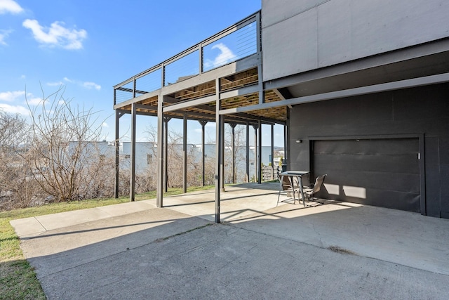 view of patio with a deck with water view