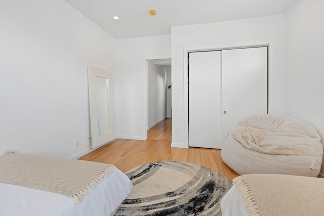 bedroom featuring a closet and light hardwood / wood-style flooring