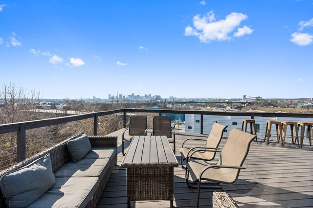 wooden terrace featuring outdoor lounge area