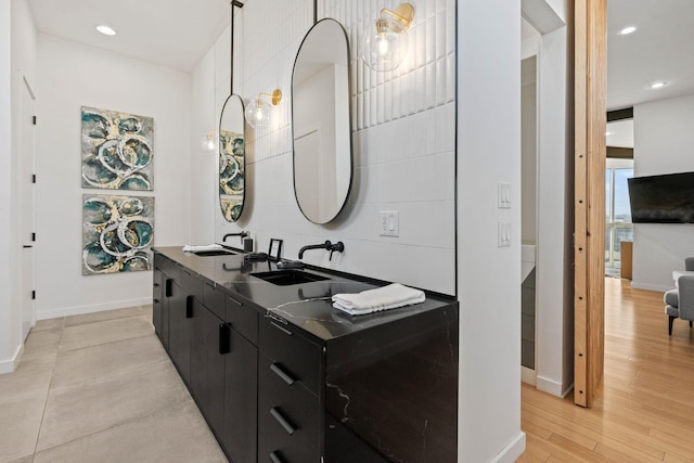 bathroom featuring hardwood / wood-style floors and vanity