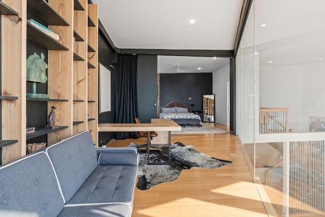 interior space featuring wood-type flooring and ceiling fan