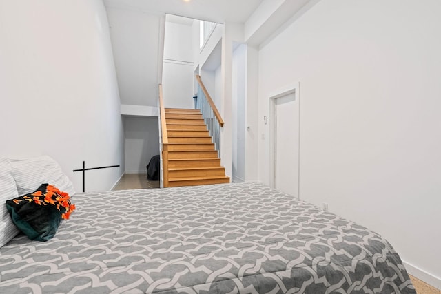 bedroom featuring light colored carpet