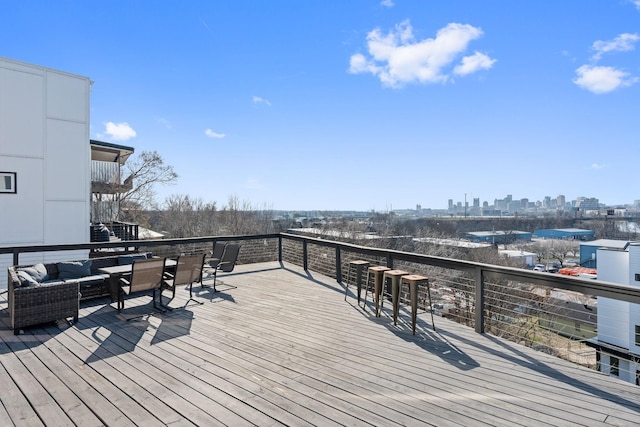 wooden terrace featuring an outdoor hangout area