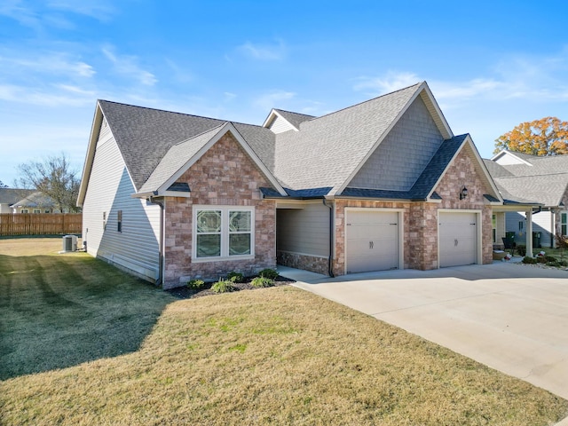 craftsman inspired home featuring a garage, central AC unit, and a front yard