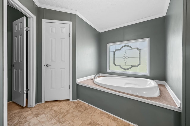 bathroom with crown molding and a bath