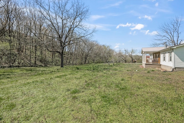 view of yard featuring covered porch