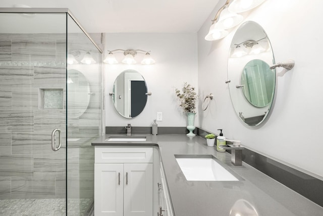 bathroom featuring vanity and an enclosed shower