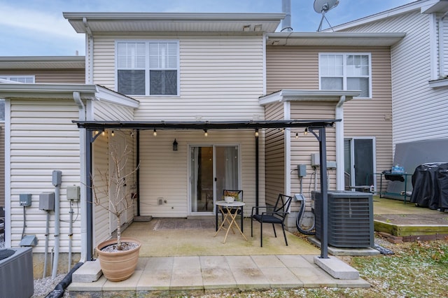 back of property featuring a patio and cooling unit