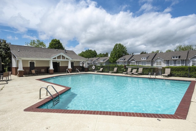 view of swimming pool with a patio