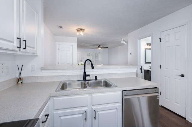 kitchen featuring stainless steel dishwasher, ceiling fan, sink, dark hardwood / wood-style floors, and white cabinetry