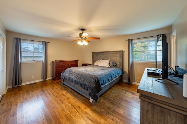 bedroom featuring ceiling fan and hardwood / wood-style floors