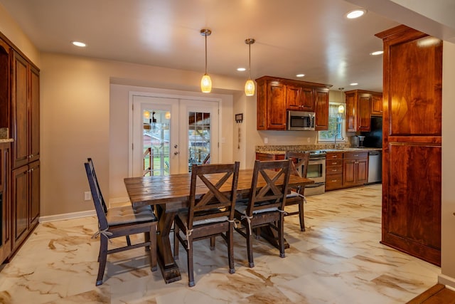 dining room with french doors and sink