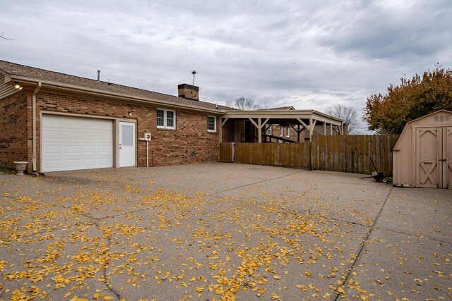 view of home's exterior featuring a shed and a garage