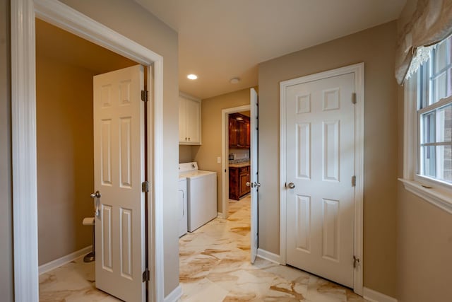 hallway with washing machine and clothes dryer