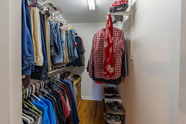 walk in closet featuring dark hardwood / wood-style flooring