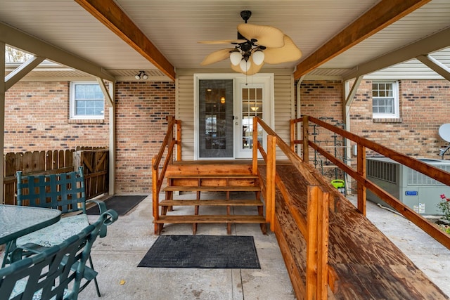 view of exterior entry featuring ceiling fan