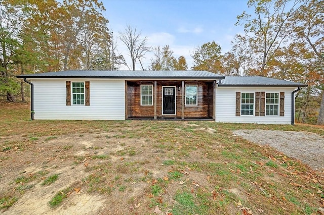 rear view of house with a lawn