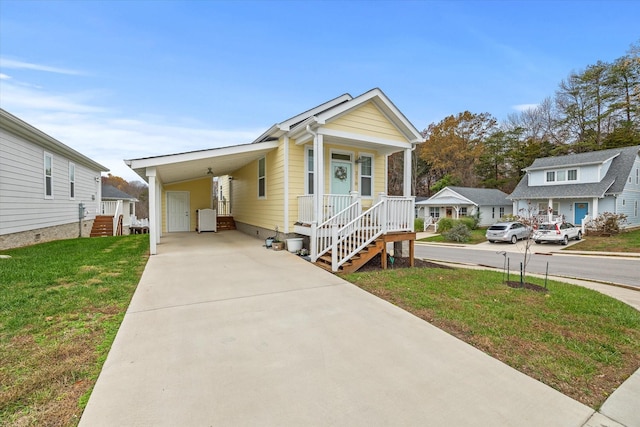 view of front facade featuring a carport and a front lawn