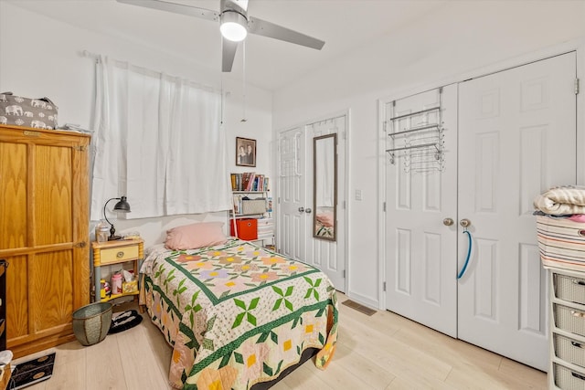 bedroom featuring light wood-type flooring and ceiling fan