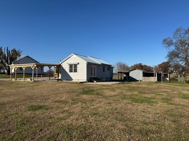 view of property exterior with a yard