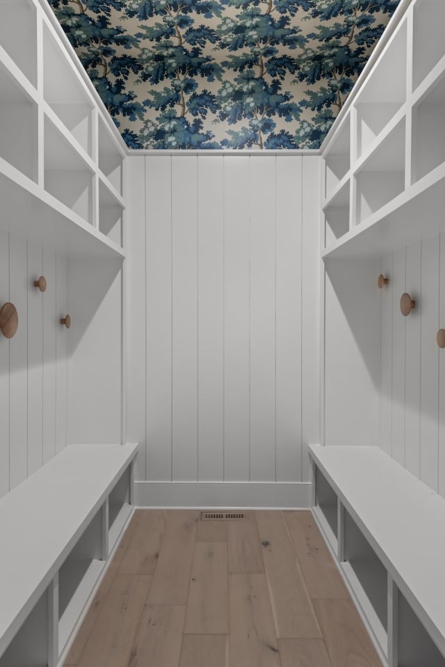 mudroom with light hardwood / wood-style floors