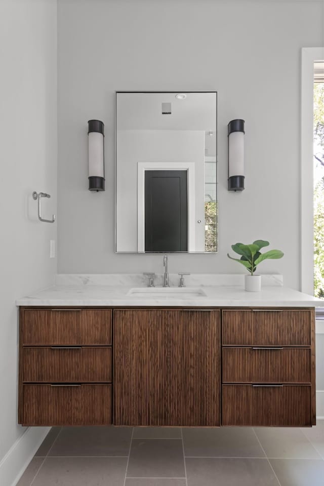 bathroom featuring tile patterned flooring and vanity