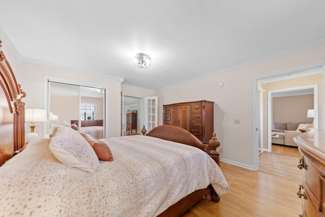 bedroom with light hardwood / wood-style floors and ornamental molding