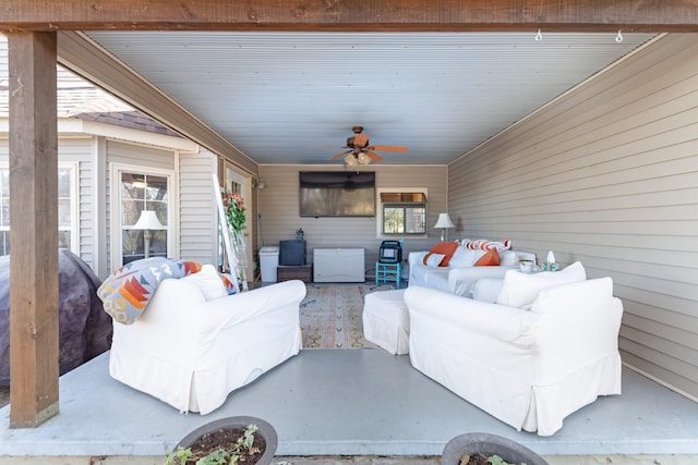 exterior space with ceiling fan and an outdoor hangout area