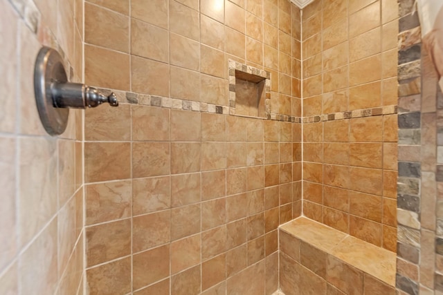 bathroom featuring tiled shower