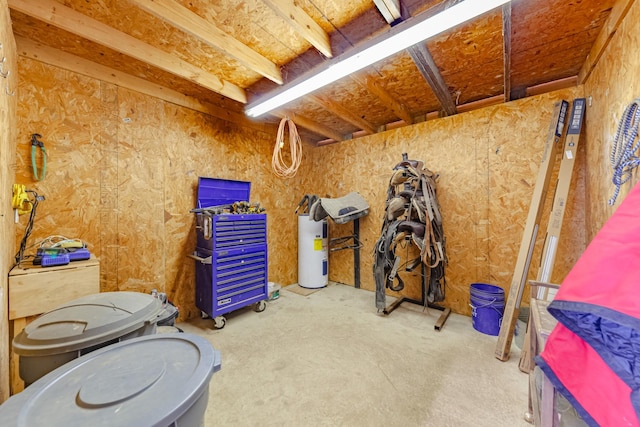 interior space featuring concrete floors and water heater