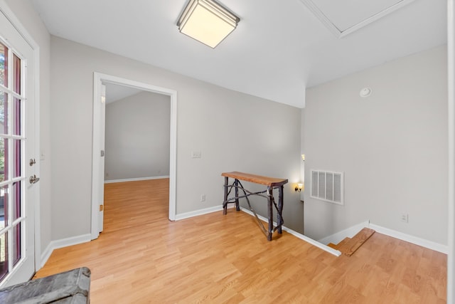 laundry room with hardwood / wood-style flooring