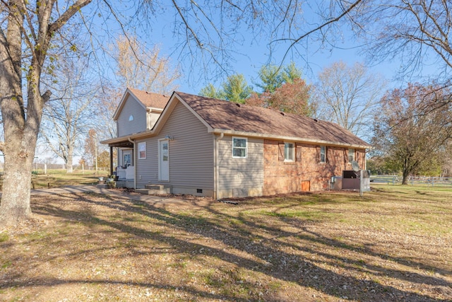 view of property exterior with a yard