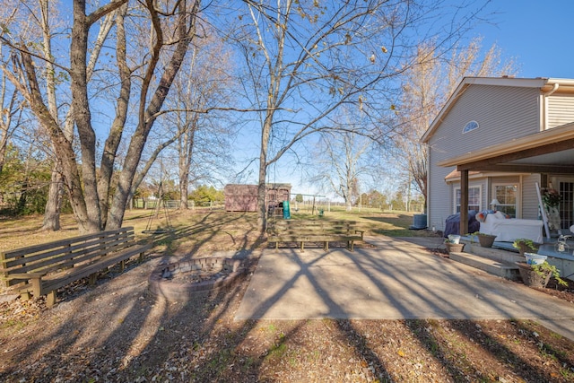 view of yard featuring a patio area and central air condition unit