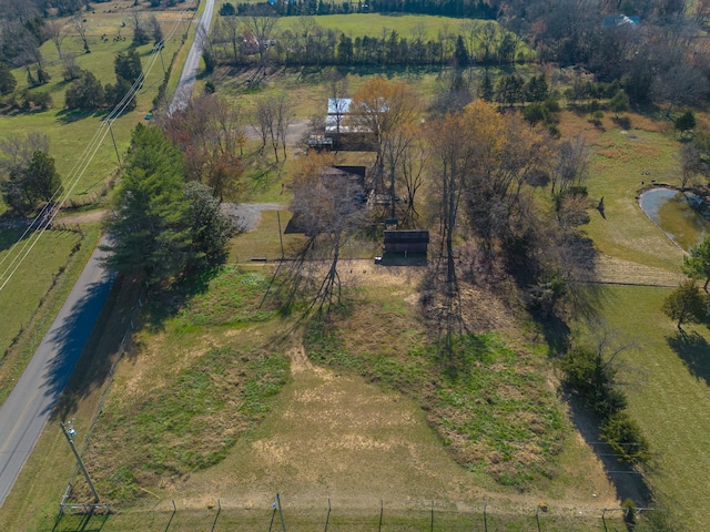 birds eye view of property with a rural view