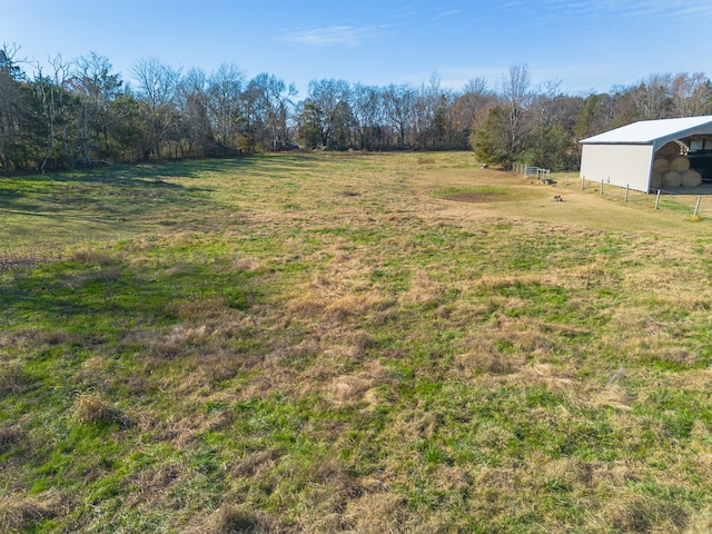 view of yard with a rural view