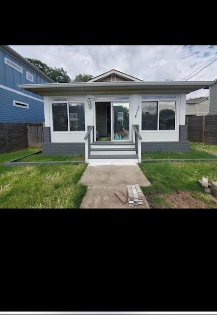 view of front of home with a front lawn