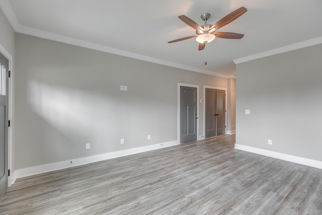 unfurnished room with ceiling fan, crown molding, and light hardwood / wood-style flooring