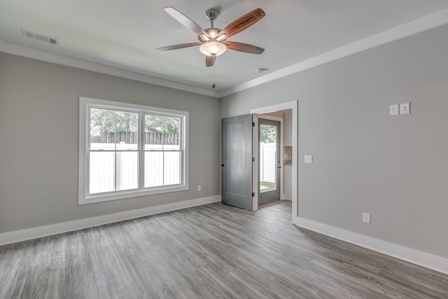 empty room featuring ceiling fan and light wood-type flooring