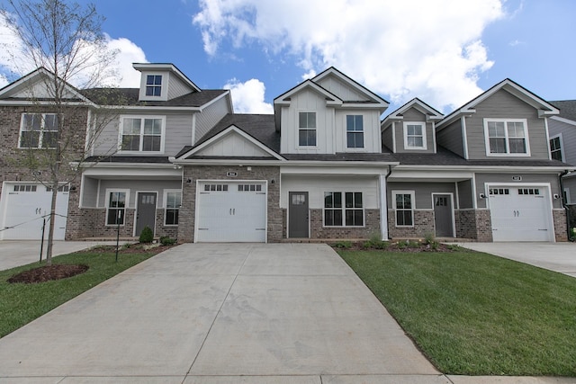 view of front facade with a front yard and a garage