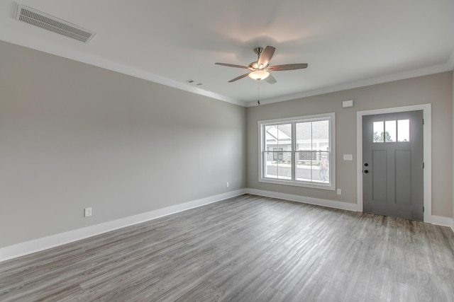 entryway with ceiling fan, light hardwood / wood-style flooring, and ornamental molding